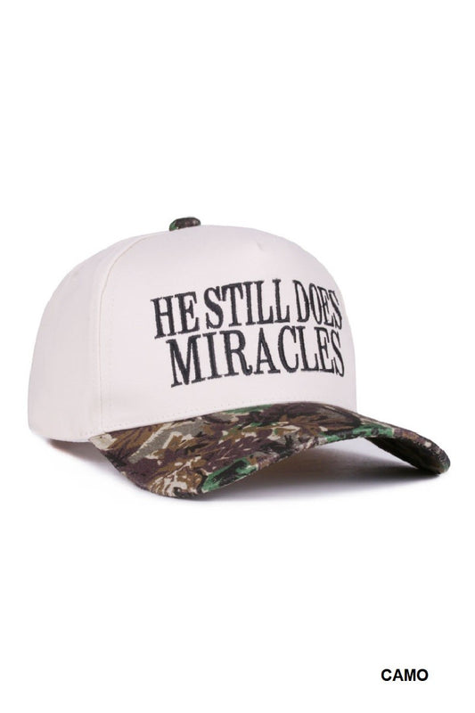 HE STILL DOES MIRACLES hat (camo)